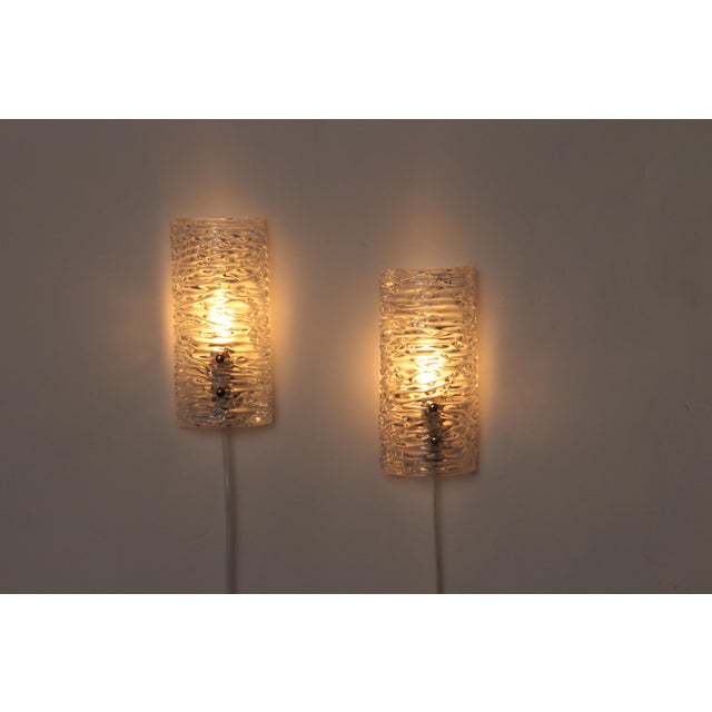 This stunning lamp, designed by Carl Fagerlund for Orrefors, features thick pressed glass with an ice relief texture. The...