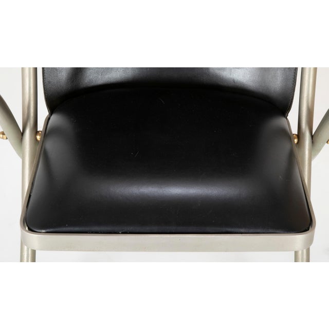 This is a rare model of a midcentury Maison Jansen campaign armchair. These chairs are typically made with paw feet, this...