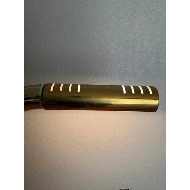 Nice brass floor lamp by Jim Bindman for Rainbow Lamp. Brass is in good condition. Light is on / off switch is activated...