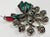 Festive vintage set of eight (8) chrome napkin rings with a jingle bell firmly attached to each ring. Age wear.