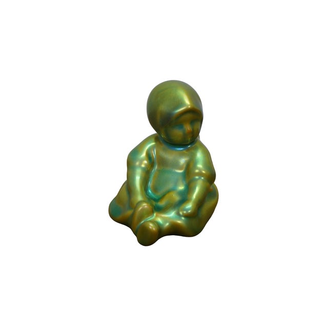 Vintage Zsolnay Eosin iridescent green and gold porcelain / ceramic figurines made in Pécs, Hungary, featuring a seated...
