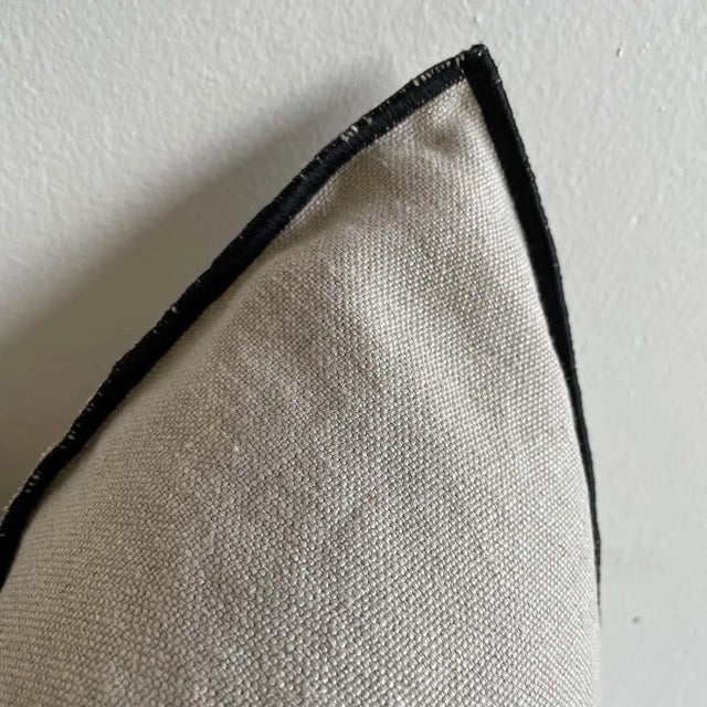 Custom linen blend accent pillow. Color: Natural A beige/ white colored nubby textured style pillow with a stitched edge,...
