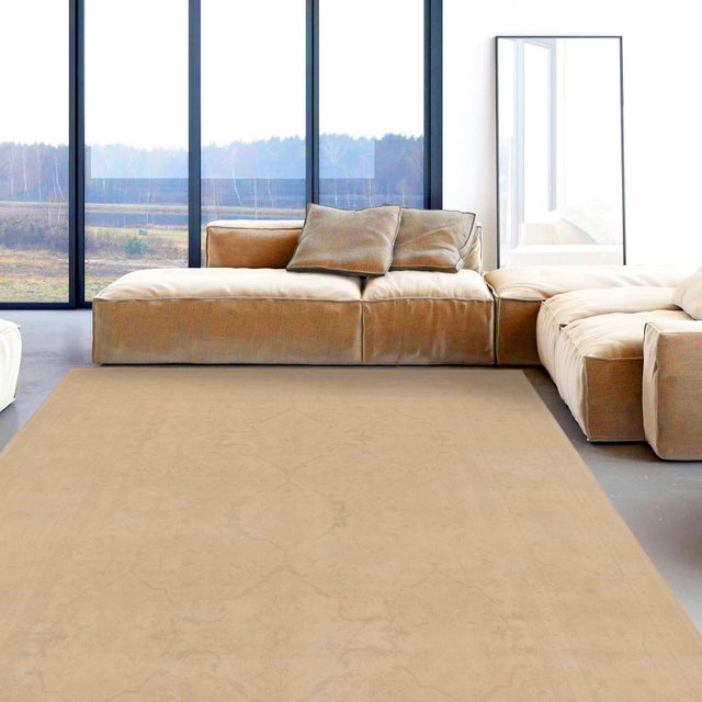 Enhance the ambiance of your home with this magnificent Persian-influenced Turkish hand-knotted rug made by skilled...