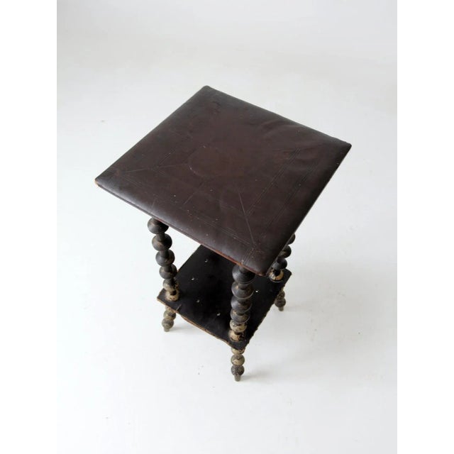 This is antique Victorian spool art table exhibits a sophisticated folk art sensibility. Wearing a wonderfully mottled...