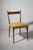 This exceptional set of eight Model S11 dining chairs stands as a definitive testament to the golden era of post-war...
