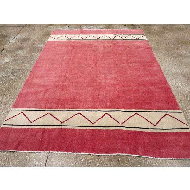 A vintage Turkish Art Deco style small room size carpet handmade during the Mid-20th Century. Measures: 7' 0" x 9' 9".