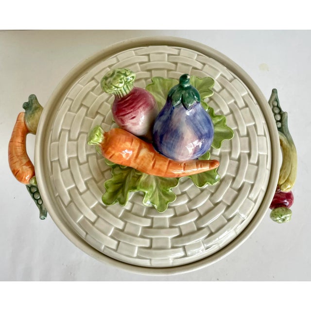 Here is a charming, lidded serving dish made by Fitz and Floyd in the 1980's. The piece is made of porcelain with a...