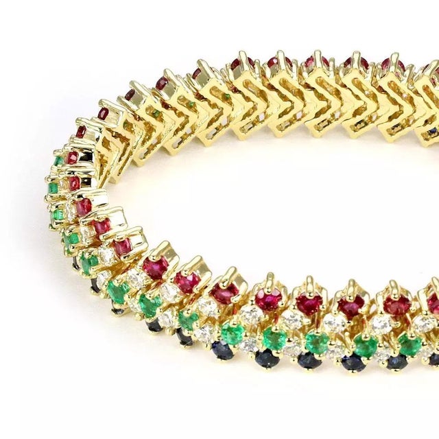 This is a stunning wide flex bracelet, it is crafted from 18k yellow gold with a high polished finish featuring 5 rows...