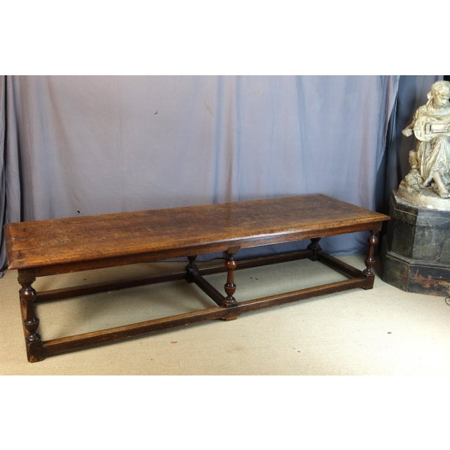 Very large oak table from the early 19th century. It rests on a baluster base with stretchers. There are some signs of...