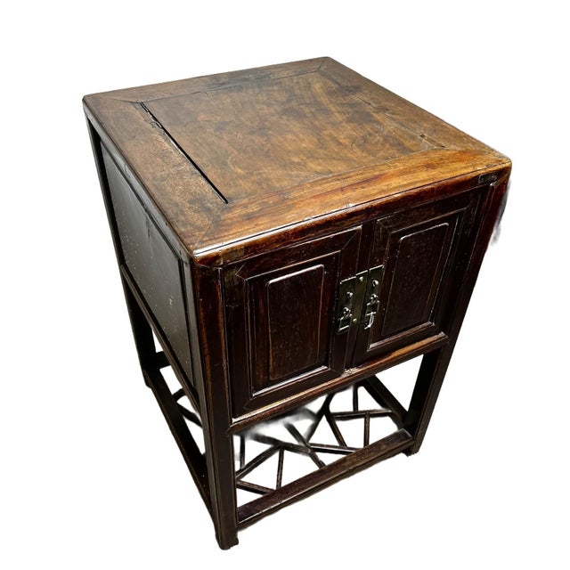 The antique cabinet represents traditional Chinese furniture craftsmanship from Jiangnan - the area of Zhejiang and...