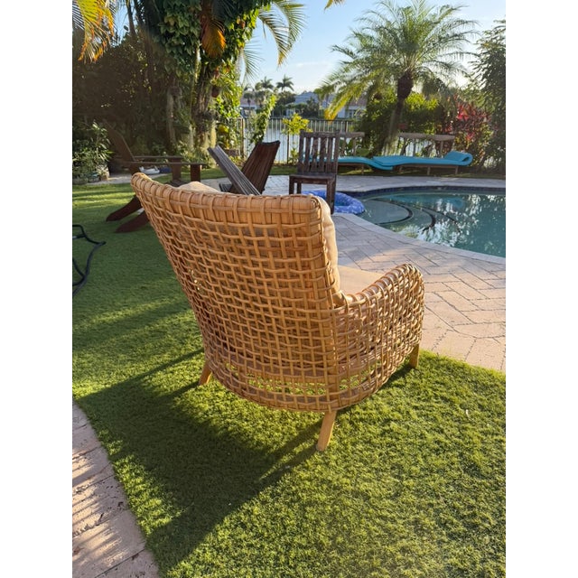 Warm honey tones and an open lattice give this Palecek Aries lounge chair the relaxed elegance of a thoughtfully layered...