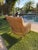 Warm honey tones and an open lattice give this Palecek Aries lounge chair the relaxed elegance of a thoughtfully layered...
