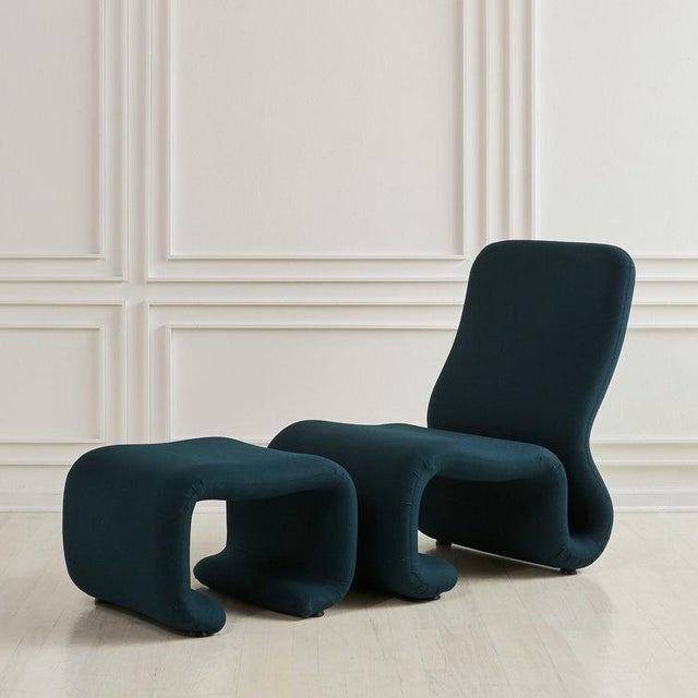 In the style of Michael Boyer and Verner Pantone. A European ribbon Chair with matching ottoman. Fully restored with new...