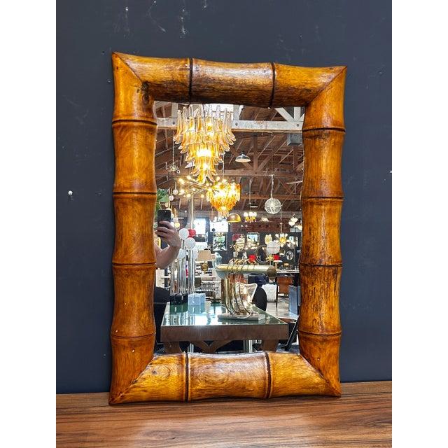 "An exquisite vintage Italian rectangular wood wall mirror from the 1980s, showcasing the timeless beauty of Italian...