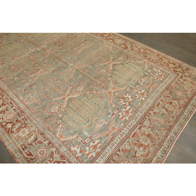 An early 20th Century Corridor Size Persian Bibikabad Carpet with an all-over willow tree pattern in warm colors Details...