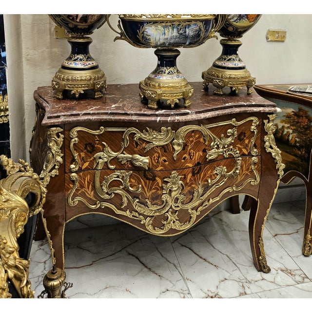 Bring timeless European elegance to your interior with this exquisite French Rococo-style commode, featuring a beautifully...