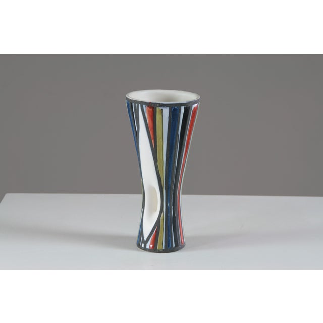 A striking example of Roger Capron's talent and creative vision, this openwork Diabolo vase embodies the elegance of...