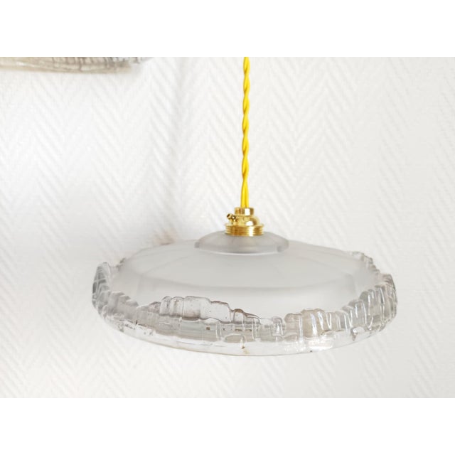 Pair of Art Deco pendant lights, circa 1930/1940 Pair of Art Deco molded glass globes in the style of EZAN's creations...