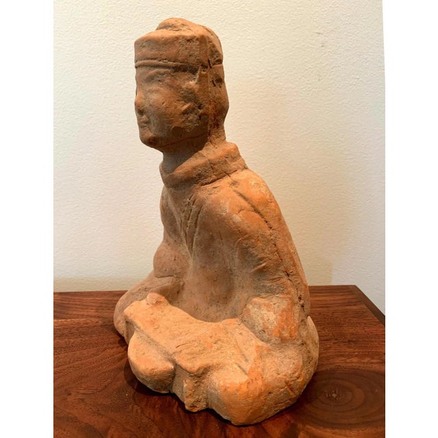 A small Chinese terracotta tomb figure (Ni Yong) from East Han dynasty (25-220 AD), likely from the area of nowadays...