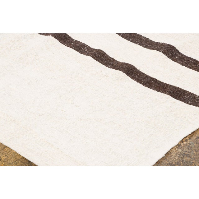 Handwoven from recycled vintage hemp and originating from Turkey circa 1950-1959, this 9x12 vintage kilim joins Rug &...