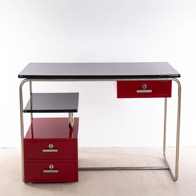 Chrome-plated tubular steel, body and table top painted in black and crimson red.
