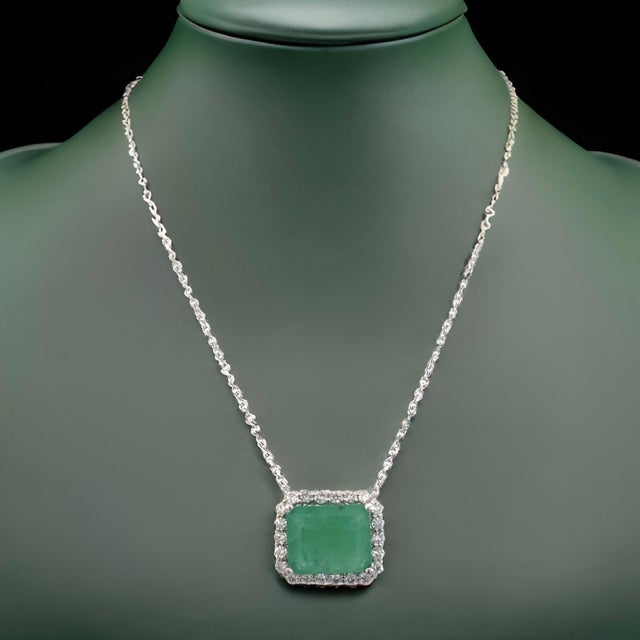 Natural Quality Emerald and Diamond Pendant Necklace with an 18" chain and set in 14k White Gold with a ct weight of 2.64...