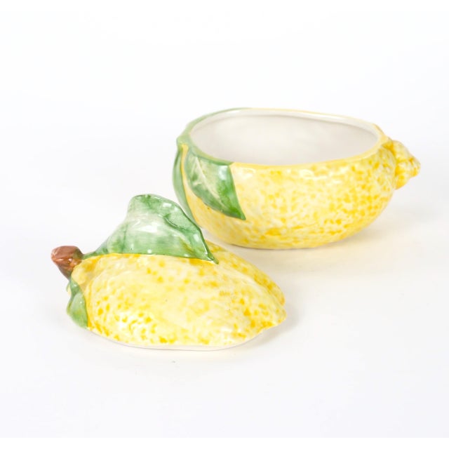 A charming late 20th-century Italian majolica covered table ornament modeled in the form of a ripe lemon. The piece is...