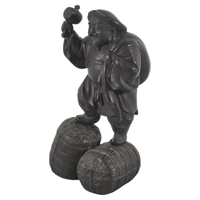 Solid bronze sculpture of Daikokuten (or Daikoku), one of the Seven Gods of Fortune (Shichifukujin) of Japan. He is the...