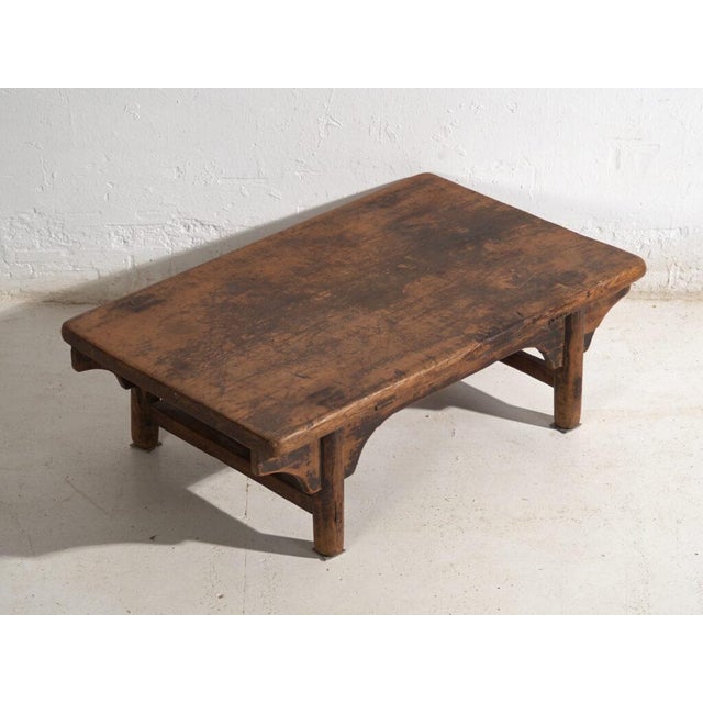 Antique low table in pine wood, traditional chinese furniture originating from shanxi and dated circa 1930. Originates...