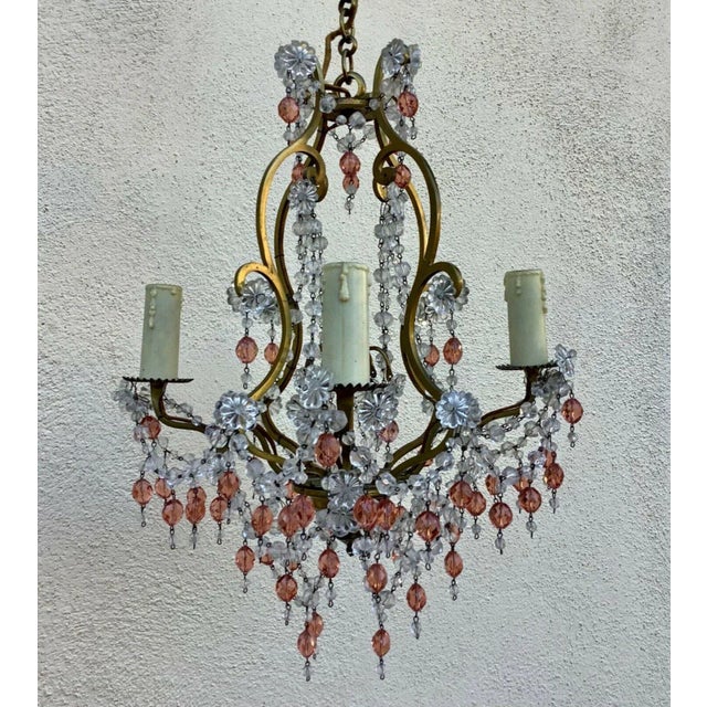 Lovely and Petit 1940's French Regency Bronze Cage with Pink and Clear Crystal Chandelier. 4 lights and lots of original...