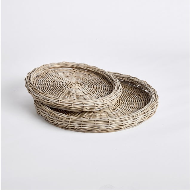 The Round Rattan Tray Set - Set of 2 Large Size: 29 x 29 x 3 Small Size : 23.25 x 23.25 x 2.75 Made of a large gauge...