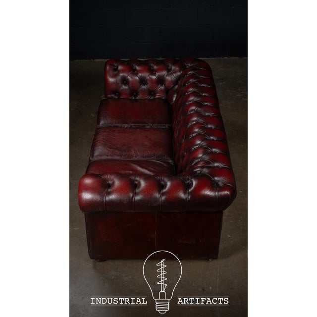 English Vintage Oxblood Leather Three-Cushion Chesterfield Sofa For Sale - Image 3 of 9