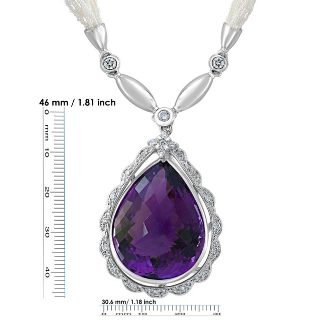 54 Carat Tear Drop Amethyst & Diamonds with Seed Pearl Necklace 18 K Gold 18 K White Gold This extraordinary Necklace is...