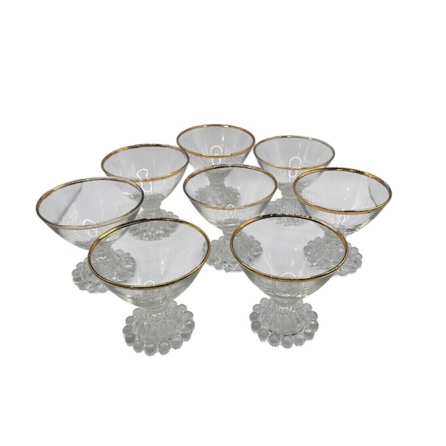 A set of Eight (8) Berwick "Boopie" champagne glasses. Classic 50’s pressed glass design from Anchor Hocking with hobnail...