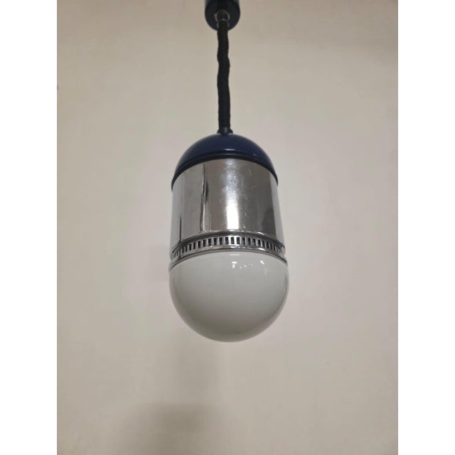 Sisten series chandelier by Gianni Celada for Fontana Arte Suspension lamp in lacquered metal, chromed metal, and opal...