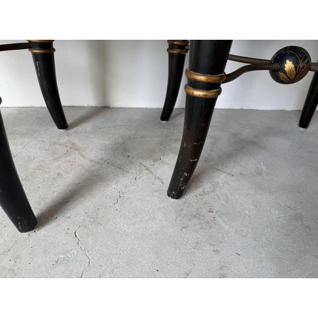 Pair of Vintage Hollywood Regency Black & Gold Ebonized Ottomans With Brass “X” Stretcher Base and Tufted Cushions For Sale - Image 9 of 12