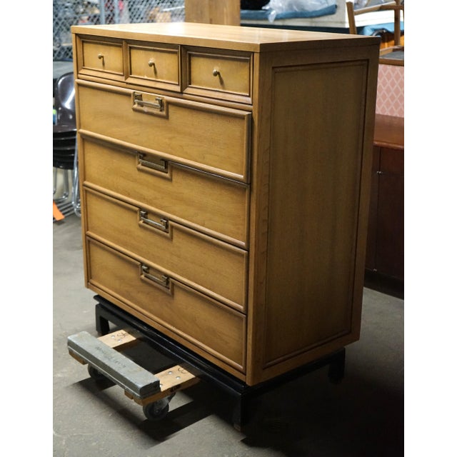 Mid-Century highboy dresser by American of Martinsville. This 1960's piece features a bleached mahogany case with 3 small...