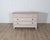 A distinctive early 19th-century Danish chest of drawers, painted in a soft antique white with warm undertones that...