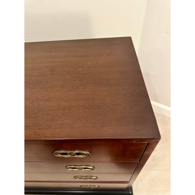 Beautiful satin wood and ebonized 9 drawer dresser. Brass interlocking hardware on a black ebonized 4 leg platform elevate...