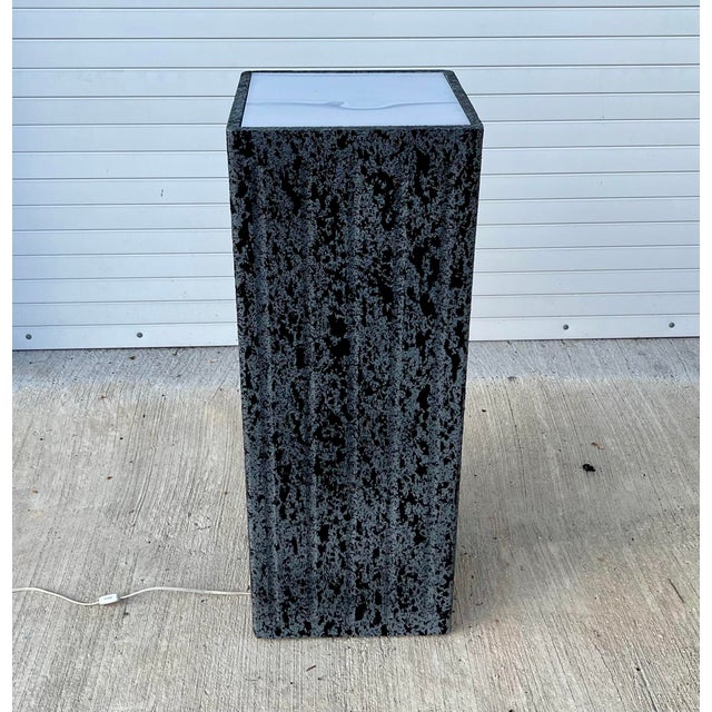 1980s postmodern pedestal, with a textured black and gray finish. This piece has a white acrylic top that can be...