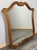 A charming Vintage French mirror featuring an elegant carved frame and beautifully shaped silhouette. The warm oak finish...