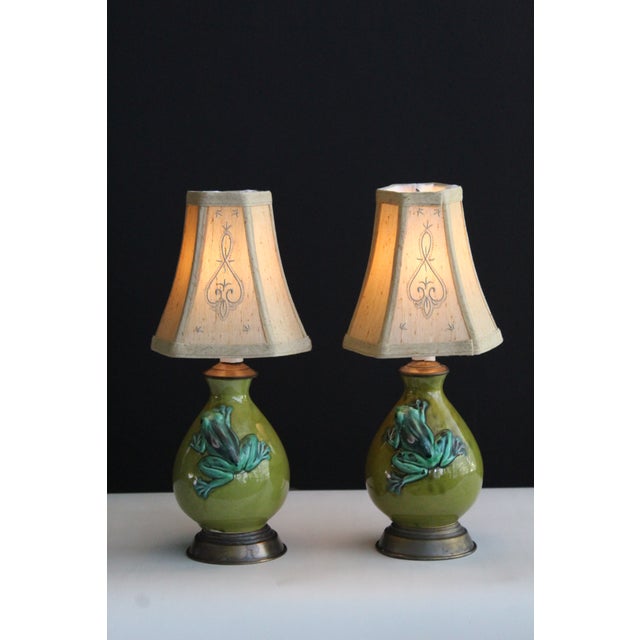 A pair of petite Bitiossi influence ceramic lamps,. Charming in presence. Serine avocado green Embossed frogs glazed...