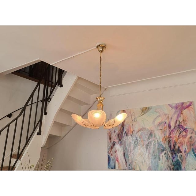 Decorative rare pendant in brass and clam-shaped glass shades. Made by reijmyre belysning, sweden late 20th century. Total...