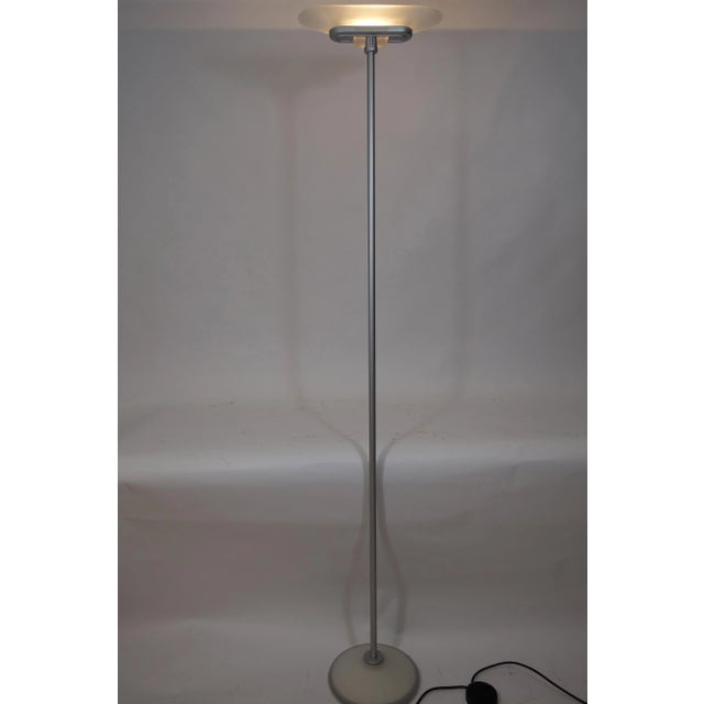 The Jill floor lamp was designed by Perry King, Santiago Miranda, Gianluigi Arnaldi for Arteluce in 1978. The frame is...