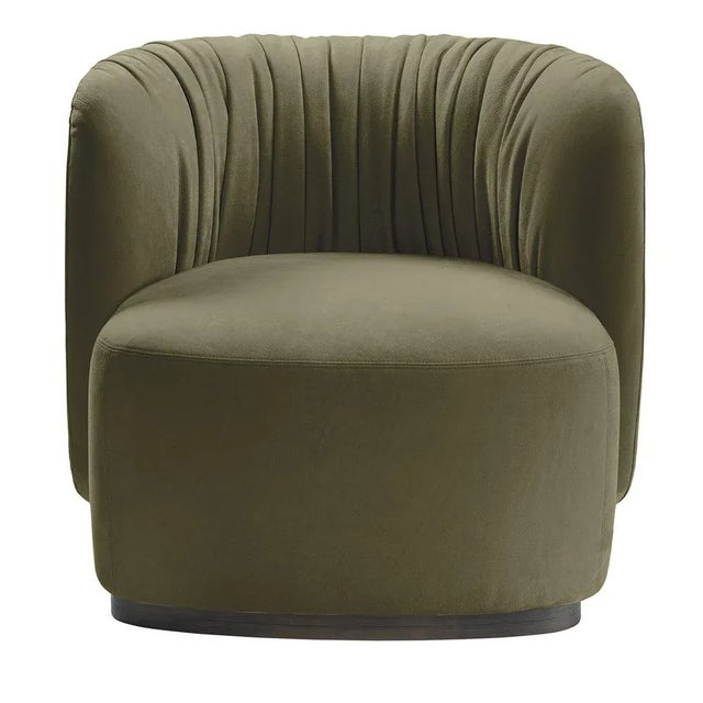 This refined armchair flaunts a plump and compact body, generously stuffed to provide a comfortable seat embraced by a...