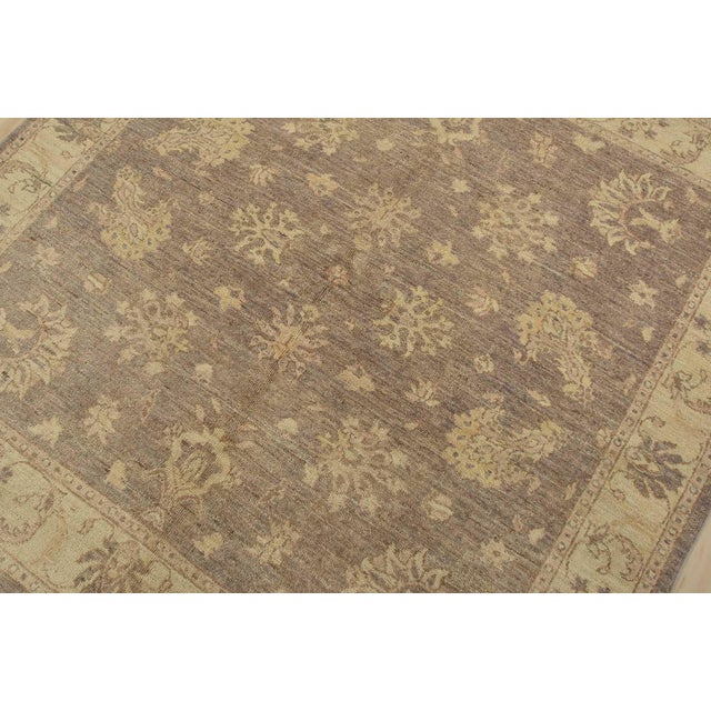 A traditional Ziegler rug hand-knotted with fine wool on a cotton foundation. This rug features an all-over subtle...