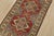 A tribal Caucasian Kazak rug hand-knotted with fine wool on a cotton foundation. This rug features geometric medallions...