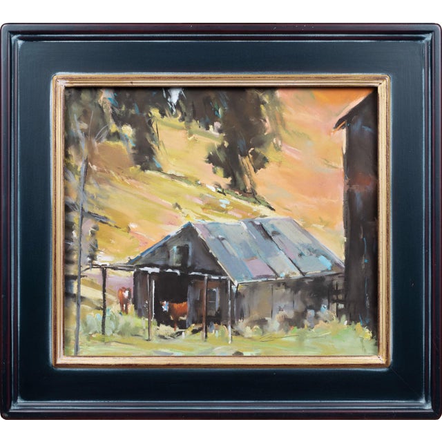 This pastel work depicts a serene rural scene featuring two cows near a rustic barn, set against a backdrop of warm,...