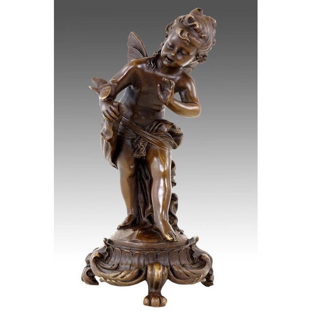 Art Nouveau bronze fairy sculpture in brown patinated bronze, style of the 20th century. This decorative bronze sculpture...