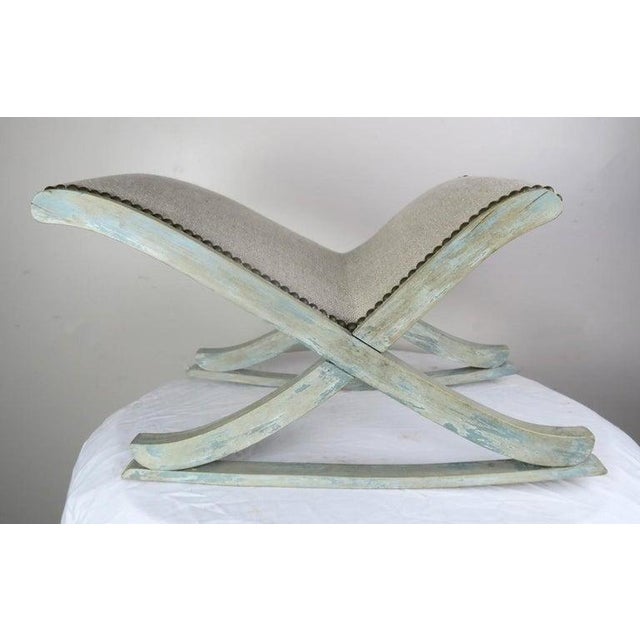 Swedish painted rocking stool that is newly upholstered in washed Belgium linen and finished with antique brass nailhead...